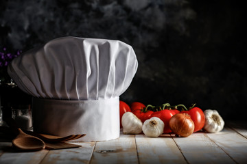 White cook hat in kitchen and free space for your decoration 