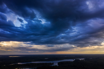 Aerial view of heavy thunderclouds over the forest of Karelia