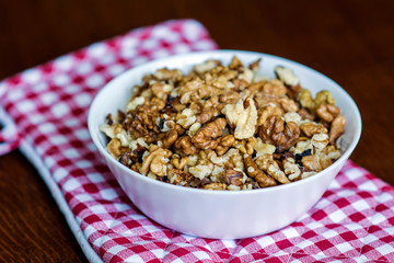 Bowl with Fresh Walnuts on a Kitchen Table 