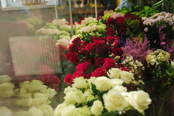 Different varieties fresh spring flowers in refrigerator room for flowers. Beautiful flowers in...