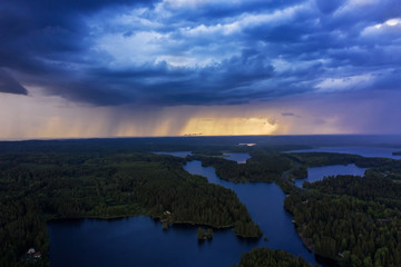 Aerial view of heavy thunderclouds over the forest of Karelia