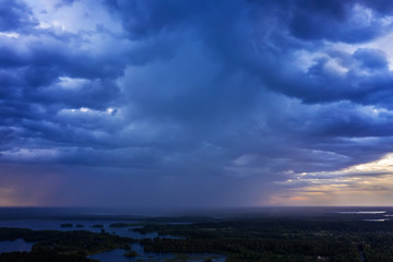 Aerial view of heavy thunderclouds over the forest of Karelia