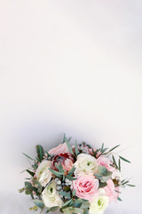 Wedding flowers, bridal bouquet closeup. Wedding invitation card template, copy space