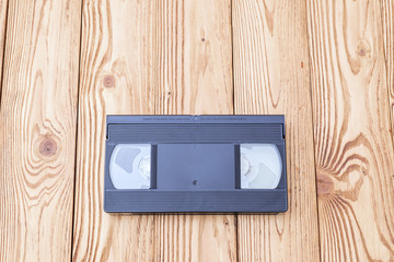 analog video cassette on wooden background
