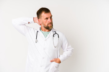 Senior doctor man isolated on white background touching back of head, thinking and making a choice.