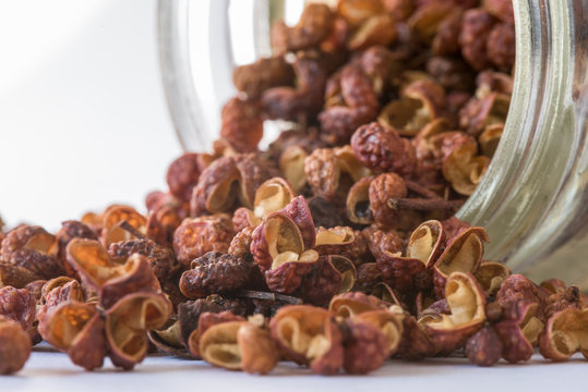Szechuan Peppercorns Spilled from a Spice Jar