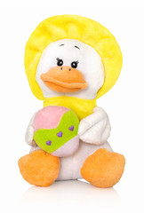 Plush duck toy with easter egg. Isolated on white background with shadow reflection. With clipping path. Closeup shot of easter duck with painted easter egg. With vector path. Duck plushie with egg.