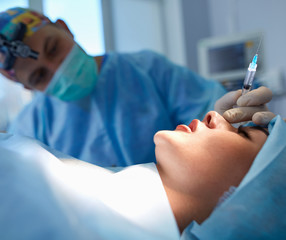 Man surgeon at work in operating room