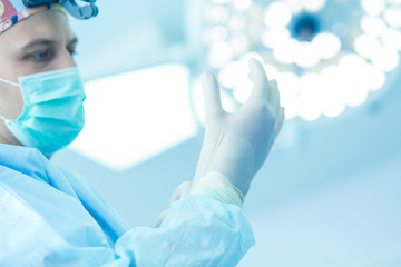 Man surgeon at work in operating room