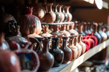 Bronze and copper handcrafted cookware in street shop. Shaki, Azerbaijan.