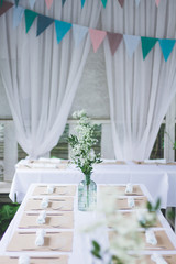 Beautiful wedding decorated table with a white tablecloth