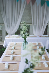 Beautiful wedding decorated table with a white tablecloth