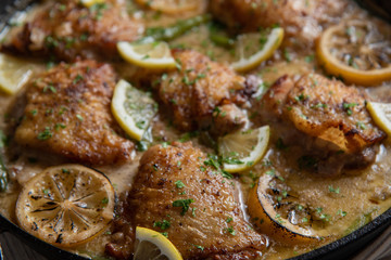lemon butter chicken in iron skillet
