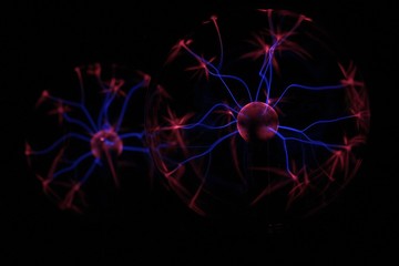 Photograph. Stylized photo of a coronavirus. Blurred image with multi-colored rays on a black background.