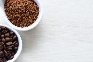Coffee beans, accompanied by processed coffee powder