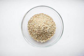 cereal oatmeal in a glass plate. Porridge for morning breakfast