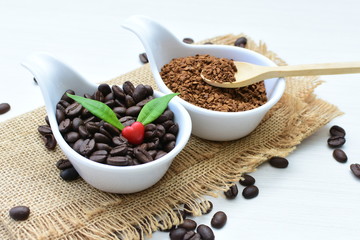 Coffee beans, accompanied by processed coffee powder