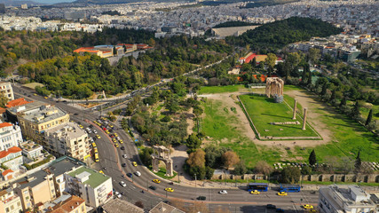 Fototapeta na wymiar Aerial drone photo of famous column ruins of Temple of Zeus in the slopes of Acropolis hill and the Parthenon, Athens, Attica, Greece