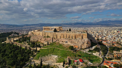 Fototapeta na wymiar Aerial drone photo of Masterpiece Acropolis hill and the Parthenon and theatre of Dionysus seen below on a beautiful sunny morning, Athens, Attica, Greece