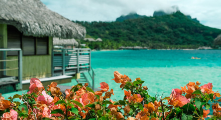 Fototapeta na wymiar Overwater bungalow with breathtaking lagoon and view of Bora Bora, French Polynesia