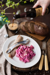 Homemade Beet and Potato Salad Served with Salted Herring Fillet