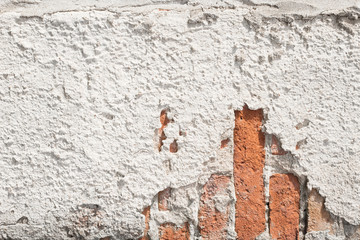 brick wall with pieces of cement