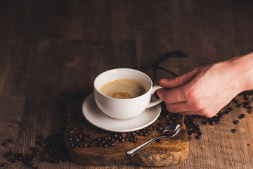 cup of coffee on wooden table