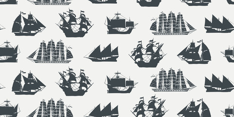 Vector seamless pattern on the theme of nautical travel, adventure and discovery with silhouettes of various sailing ships in retro style. Suitable for background, wallpaper, wrapping paper, fabric