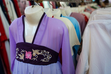 Row of ladies dresses for sale in chinese shop