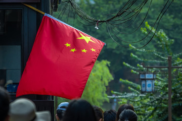 Chinese flag over Old Town street in Feng Huang