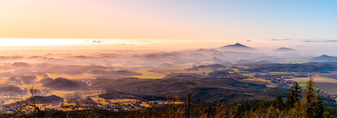 Hilly landscape on sunny and foggy day. Weather inversion. Central Bohemian Highlands, Czech: Ceske...