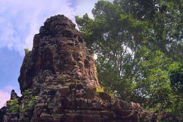 Fototapeta na wymiar Face tower on the eastern entrance of Banteay Kdei temple, in Angkor Wat city complex, Cambodia.