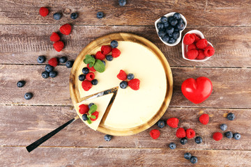 Homemade cheesecake with fresh raspberries and mint for valentines day - healthy organic summer dessert pie cheesecake. Vanilla Cheese Cake for dessert