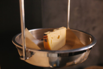 Slice of cheese weigh in cheese store