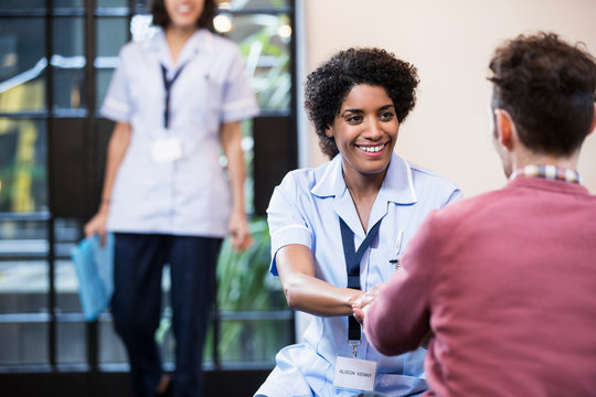 Portrait of Woman in healthcare industry having consultation with patient, East London, Great Britian