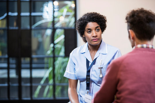 Portrait of Woman in healthcare industry having consultation with patient, East London, Great Britian