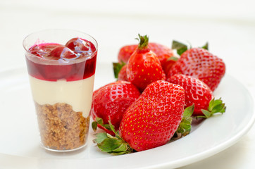 cheesecake in plastic cup with strawberry