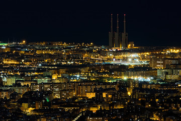 Night city illuminated by thousands of light bulbs, Barcelona, ​​Spain
