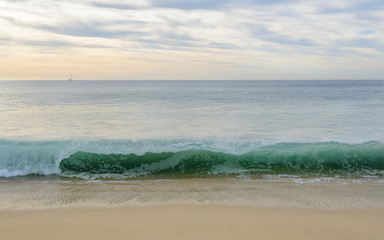 View over inlet, ocean and island with mountains.
