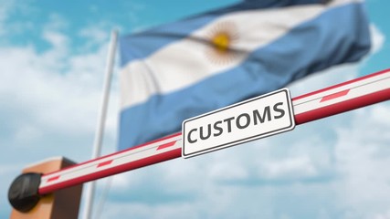 Closed boom gate with CUSTOMS sign on the Argentinean flag background. Border closure or protective tariffs in Argentina