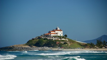 Saquarema - Itaúna Saquarema beach with a church in the background