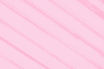 Pale pink coral background with diagonal stripes