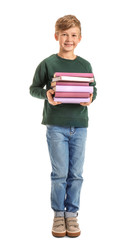 Little boy with books on white background