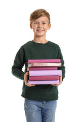 Little boy with books on white background