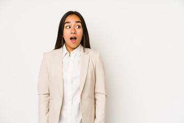 Young woman isolated on a white background being shocked because of something she has seen.