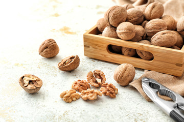 Composition with tasty walnuts on table