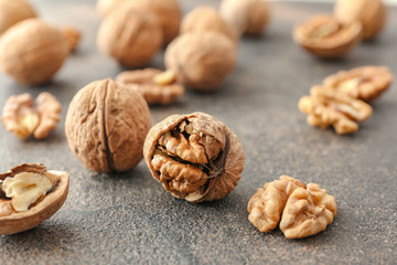 Tasty walnuts on grey table