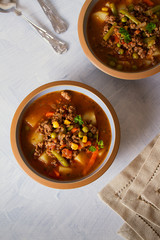 Delicious hamburger soup with vegetables. Healthy nutrition food. View from above, top view