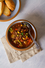Delicious hamburger soup with vegetables. Healthy nutrition food. View from above, top view