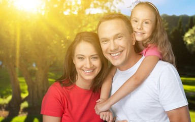 Happy smiling family with child daughter